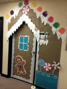 gingerbread house door decoration idea for winter and holiday door decorating
