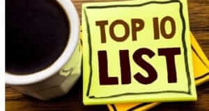 Coffee mug and a yellow post-it that says TOP 10 LIST