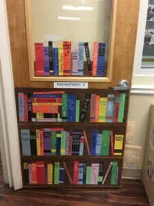 Door decorated as book shelf