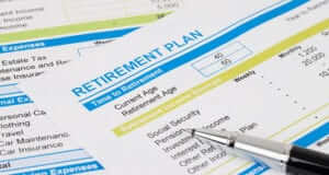 Retirement plan papers listing current age, retirement age, and retirement income sources and expenses