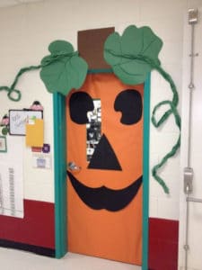 Classrom door decorated as a jack-o-latern