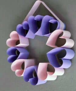 Wreath of purple and pink hearts made out of construction paper
