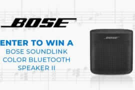 Enter to win a Bose Soundlink Color Bluetooth Speaker II - Black Bose speaker with music notes in the background