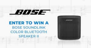 Enter to win a Bose Soundlink Color Bluetooth Speaker II - Black Bose speaker with music notes in the background