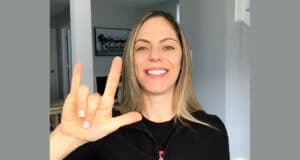 Dana Vander, Sign Language Interpreter, Sovereign Avenue Elementary School, Atlantic City, NJ. She's saying "I love you" in sign language