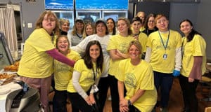 Teacher Stories: Chrissy Rice, ESL teacher at Manasquan School District (pictured, center, in white shirt with the employees of Kindness Café.)